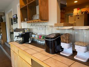 a kitchen with a counter with a coffee maker on it at SkyRidge Inn in Torrey