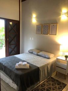 Katil atau katil-katil dalam bilik di N12 Casa 3 dormitórios em condominio frente a praia