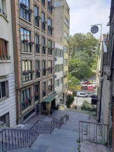 an apartment building with stairs leading up to it at Spacious & Trendy 3BR Urban Home w/ ACs in Istanbul