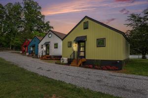 a group of houses sitting on a gravel road at Tranquille Resort in Hiawassee +32 photos