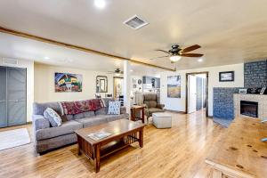 a living room with a couch and a fireplace at Rocking S Ranch in Cottonwood