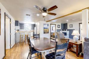 a dining room and kitchen with a table and a ceiling fan at Rocking S Ranch in Cottonwood