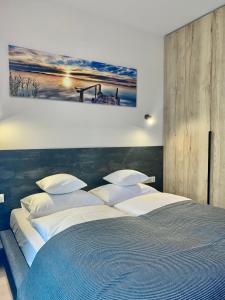 Posteľ alebo postele v izbe v ubytovaní REMAR - Apartamentai prie Biale Ežero