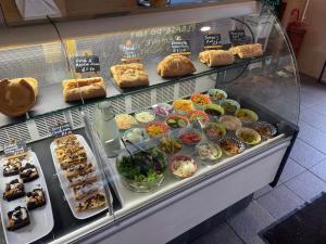 a bakery display case with many different types of pastries at Superior Glamping Pod with Hot Tub in Frodsham