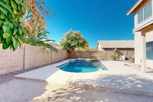 a swimming pool in the backyard of a house at Silverwood Getaway in Phoenix