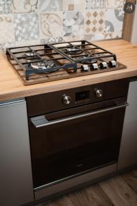 a black stove top oven in a kitchen at AH Lomená in Košice