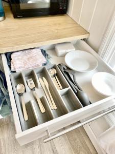 a drawer in a kitchen with utensils at Eleuthera Retreat - Villa & Cottages on pink sand beachfront in North Palmetto Point