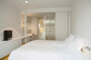 Postel nebo postele na pokoji v ubytování Hotel Muske Pitter