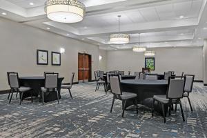 a conference room with a table and chairs at Four Points by Sheraton Birmingham Homewood in Homewood +13 photos