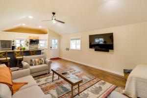 a living room with a couch and a table at Columbia Falls Studio 20 Mi to Glacier Natl Park in Columbia Falls