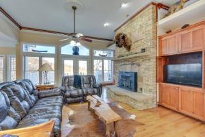 a living room with a couch and a fireplace at Blairsville Mansion with Hot Tub, Casino and Games! in Blairsville