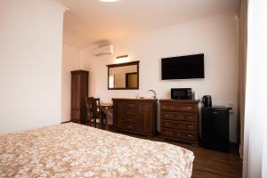 TV a/nebo společenská místnost v ubytování CORNER HOUSE