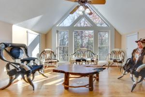 a room with chairs and a table and a window at Blairsville Mansion with Hot Tub, Casino and Games! in Blairsville