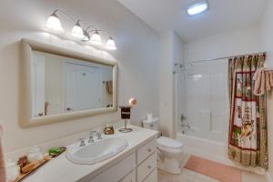 a bathroom with a sink and a toilet and a shower at Blairsville Mansion with Hot Tub, Casino and Games! in Blairsville +40 photos