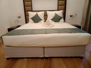 Een bed of bedden in een kamer bij Hotel Konark