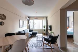 a living room with a couch and a table at Modern & Newly furnished 1BR Flat w/ Balcony & AC in Istanbul