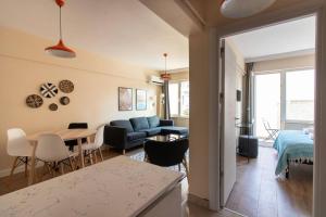a living room with a couch and a table at Modern & Newly furnished 1BR Flat w/ Balcony & AC in Istanbul