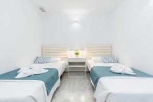 En eller flere senge i et værelse på Apartamento Seaview Deluxe + 23 billeder