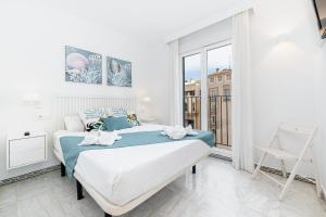 En eller flere senge i et værelse på Apartamento Seaview Deluxe