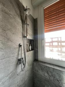 a shower in a bathroom with a window at Appartamento Barbieri in Bologna +32 photos
