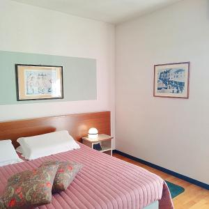 Postel nebo postele na pokoji v ubytování Casaalbergo La Rocca