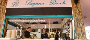a couple of people standing in front of a store at Laguna Green Apartment in Torrox Costa +26 photos