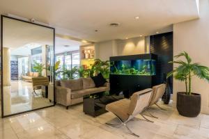 a living room with a large aquarium in the middle at Principado Downtown in Buenos Aires
