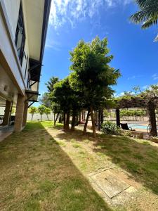 a group of trees next to a building at Hotel Living,The Persimmon double beds 4pax (904) in Cebu City