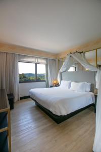 Cama ou camas em um quarto em Spa do Vinho Condomínio Vitivinícola