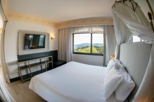 Cama ou camas em um quarto em Spa do Vinho Condomínio Vitivinícola