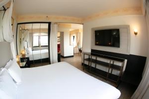 Cama ou camas em um quarto em Spa do Vinho Condomínio Vitivinícola
