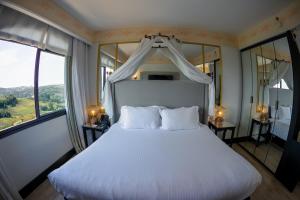 Cama ou camas em um quarto em Spa do Vinho Condomínio Vitivinícola