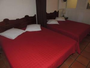 En eller flere senge i et værelse på ANSE DES ROCHERS + 7 billeder