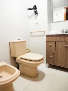 a bathroom with a toilet and a sink at COSTA AZUL in Puerto de Sagunto