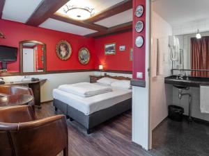 a hotel room with a bed and a sink at A-Train Hotel in Amsterdam +167 photos