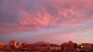 a cloudy sky with a mountain in the background at Studio Apartment in Catania