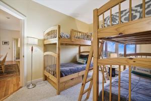 a bunk bed room with two bunk beds at Gorgeous views, tastefully decorated Ski on ski off 3 bedroom condo, with sports center access Lodges 303 in Killington +44 photos