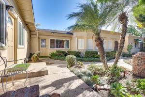a house with palm trees in front of it at Downtown Carlsbad Apartment Less Than half Mi to Beach! in Carlsbad