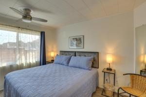 a bedroom with a bed and a window at Downtown Carlsbad Apartment Less Than half Mi to Beach! in Carlsbad