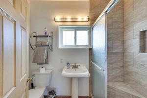 a bathroom with a sink and a toilet and a shower at Downtown Carlsbad Apartment Less Than half Mi to Beach! in Carlsbad