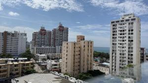 a view of a city with tall buildings at El Morro Beach 2 in Santa Marta