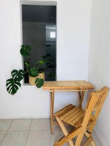 a wooden desk and a chair in a room at Casa Tanah in Guadalajara