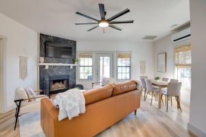 a living room with a couch and a fireplace at Modern Graford Cabin Walk to Possum Kingdom Lake! in Graford