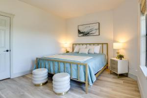 a bedroom with a bed with two stools in it at Modern Graford Cabin Walk to Possum Kingdom Lake! in Graford +27 photos