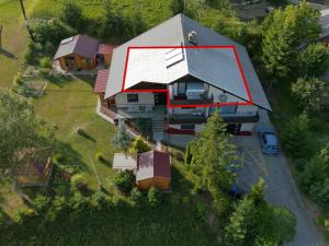 an overhead view of a house with a roof at Lookout Resort in the green heart of Slovenia in Rovte