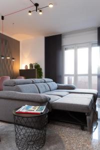 Un pat sau paturi într-o cameră la Exclusive Guest House - Fiera Milano Rho
