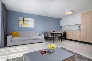 a living room with a couch and a table at LUX VISTA Suite in Umag