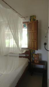 Katil atau katil-katil dalam bilik di Linda casa junto a natureza perto da Praia