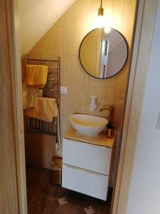 a bathroom with a sink and a mirror at Na Dziole in Lipnica Wielka