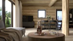 a living room with a table and a dining room at Grand Chalet Donovaly in Donovaly